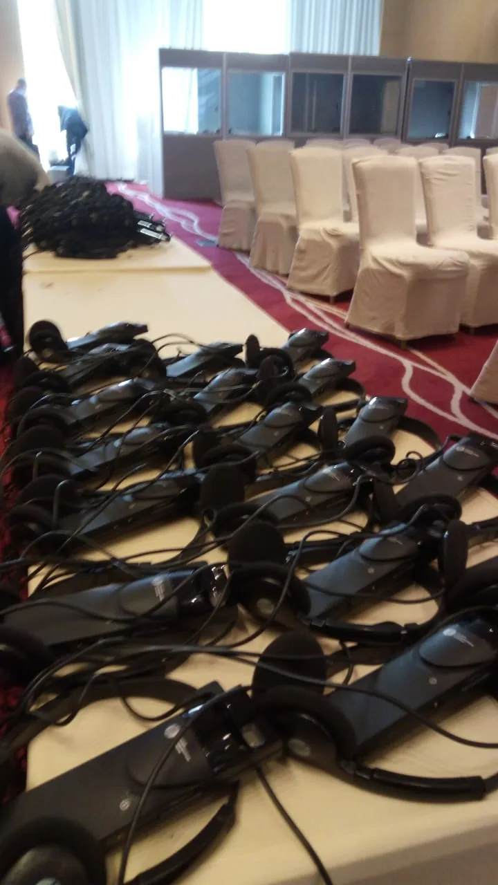 Conference interpretation receivers and headsets